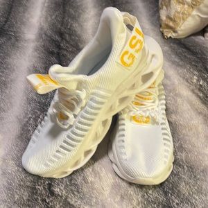 White and yellow sneakers
